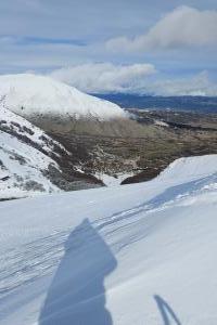 From Piazzale della Brecciara to the summit of Monte Rotondo via the Vergine slope and then the Falco off‑piste
