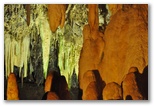 Hall of the Formations and Black Lake. The lighting enhances the beauty of the formations and the constant presence of water.